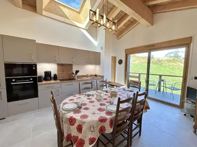 a kitchen with a table with a table cloth on it at Appartement 3 Pièces, 4-6 Couchages, Vue Montagne, Parking Privé - FR-1-597-192 in Combloux