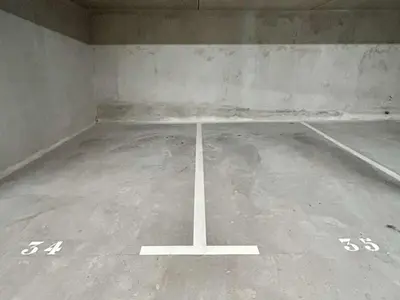 an empty parking lot with numbers on the floor at Appartement 3 Pièces, 4-6 Couchages, Vue Montagne, Parking Privé - FR-1-597-192 in Combloux