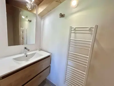 a white bathroom with a sink and a mirror at Appartement 3 Pièces, 4-6 Couchages, Vue Montagne, Parking Privé - FR-1-597-192 in Combloux