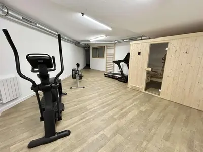 a room with a gym with exercise equipment in it at Appartement 3 Pièces, 4-6 Couchages, Vue Montagne, Parking Privé - FR-1-597-192 in Combloux