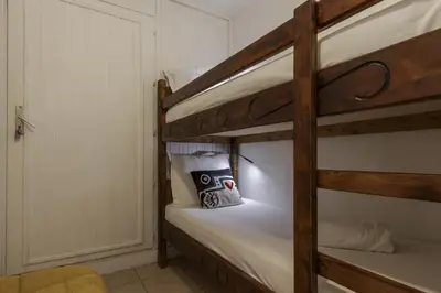 a couple of bunk beds in a room at Prarion Lac - Pied des pistes - Vue montagne in Les Houches