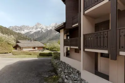 a view of the mountains from the side of a house at Prarion Lac - Pied des pistes - Vue montagne in Les Houches
