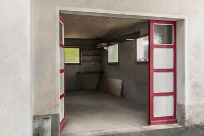 an open door into a hallway with a red door at Tout Schuss - Centre St Gervais - Vue degagee in Saint-Gervais-les-Bains