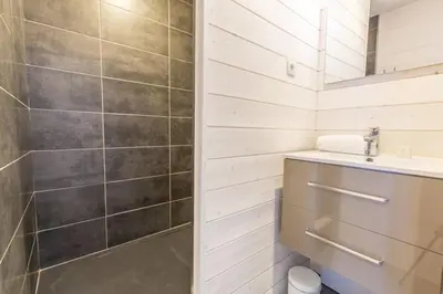 a bathroom with a sink and a shower at Chalet Zen - Sauna Hammam - Vue Mont-Blanc in Chamonix-Mont-Blanc