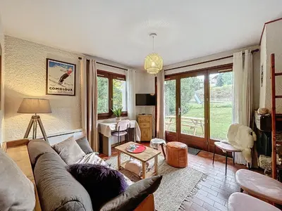 a living room with a couch and a table at Appartement 2 pièces au pied des pistes à Combloux - FR-1-560-162 in Combloux