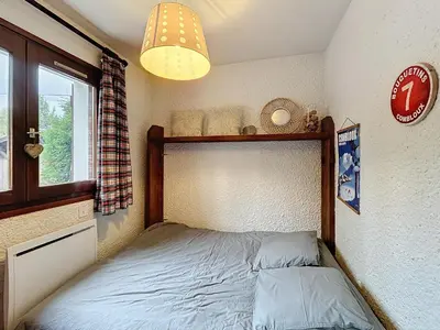 a small bedroom with a bed and a window at Appartement 2 pièces au pied des pistes à Combloux - FR-1-560-162 in Combloux