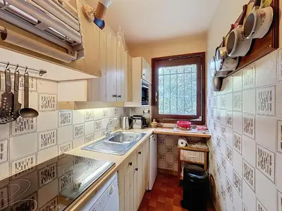 a small kitchen with a sink and a window at Appartement 2 pièces au pied des pistes à Combloux - FR-1-560-162 in Combloux