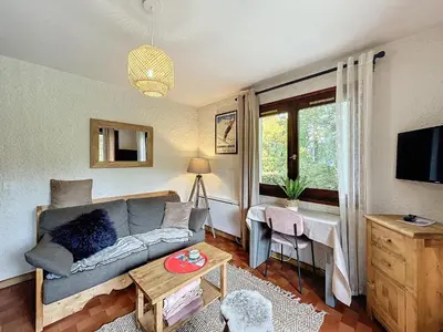 a living room with a couch and a table at Appartement 2 pièces au pied des pistes à Combloux - FR-1-560-162 in Combloux