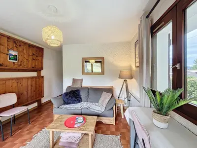 a living room with a couch and a table at Appartement 2 pièces au pied des pistes à Combloux - FR-1-560-162 in Combloux