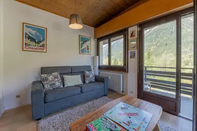 a bedroom with a bed with towels on it at Le Refuge Du Bouchet - Happy Rentals in Chamonix-Mont-Blanc