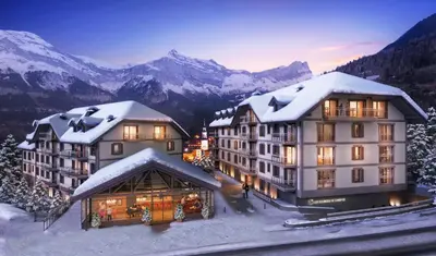 a hotel in the mountains with snow on the roofs at TERRESENS - Les Sources de Canopée in Saint-Gervais-les-Bains