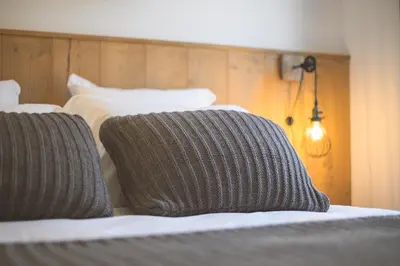 a close up of two beds with pillows on them at TERRESENS - Les Sources de Canopée in Saint-Gervais-les-Bains