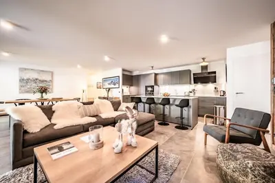 a living room with a couch and a table at Apartment Mathilde Les Houches - by EMERALD STAY in Les Houches