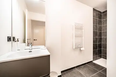 a bathroom with a sink and a mirror at Apartment Mathilde Les Houches - by EMERALD STAY in Les Houches