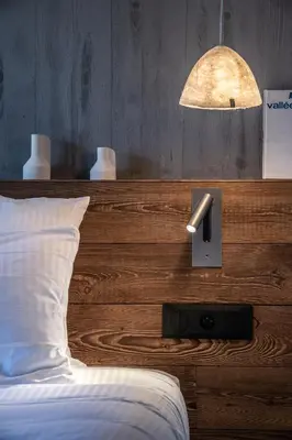 a book sitting on a shelf in a room at Chalet Foxden in Les Houches