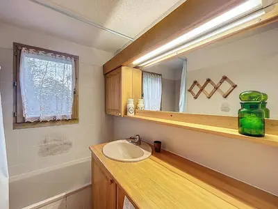 a bathroom with a sink and a mirror at Appartement proche village, accès ski bus, vue Mont Blanc - FR-1-560-163 in Combloux