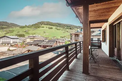 a balcony with a view of a town at Le Central - In the heart of Megève in Megève