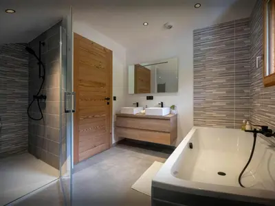 a bedroom with a desk and a bed and a table at Chalet Ormiages - OVO Network in Saint-Gervais-les-Bains
