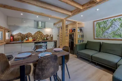 a bedroom with a bunk bed in a log cabin at Résidence Grand Roc - Bruyères 221 - Happy Rentals in Chamonix-Mont-Blanc