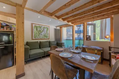 a bathroom with a toilet and a green wall at Résidence Grand Roc - Bruyères 221 - Happy Rentals in Chamonix-Mont-Blanc