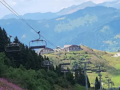 a ski lift in the middle of a mountain at SamoensDt in Samoëns