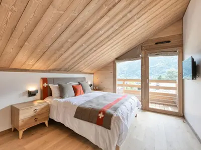 a living room with a couch and a table at Chalet familial 5 chambres, proche ski, vue Mont-Blanc, parking et WiFi - FR-1-663-28 in Saint-Gervais-les-Bains