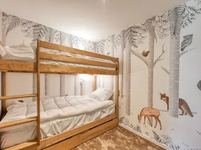 a bedroom with a large bed and a window at Chalet familial 5 chambres, proche ski, vue Mont-Blanc, parking et WiFi - FR-1-663-28 in Saint-Gervais-les-Bains