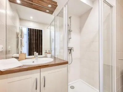 a bathroom with a sink and a shower at Saint-Gervais : Appartement rénové 2 ch, jardin, WiFi & parking - FR-1-663-34 in Saint-Gervais-les-Bains