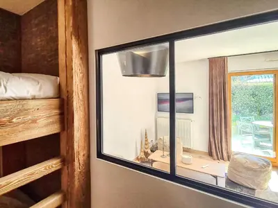a living room with a couch and a table at Saint-Gervais : Appartement rénové 2 ch, jardin, WiFi & parking - FR-1-663-34 in Saint-Gervais-les-Bains