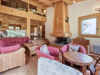 a bed in a wooden room with a window at Chalet familial à Saint-Gervais, 6 chambres, 12 pers, WiFi, parking - FR-1-663-27 in Saint-Gervais-les-Bains