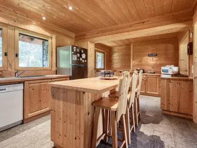 a bedroom with wooden walls and a bed in a room at Chalet familial à Saint-Gervais, 6 chambres, 12 pers, WiFi, parking - FR-1-663-27 in Saint-Gervais-les-Bains