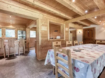a dining room with a table and chairs at Chalet familial à Saint-Gervais, 6 chambres, 12 pers, WiFi, parking - FR-1-663-27 in Saint-Gervais-les-Bains