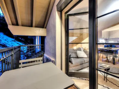 a kitchen and a dining room with a table and chairs at Appartement cosy avec cheminée et parking, proche centre - FR-1-663-38 in Saint-Gervais-les-Bains