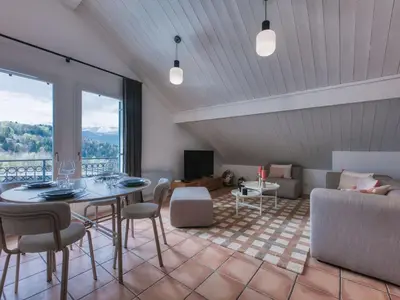 a living room with a table and chairs and a couch at Duplex 83m², 3 chambres, 6 pers, centre Saint-Gervais, à 5 min de la télécabine, Wifi inclus - FR-1-663-31 in Saint-Gervais-les-Bains