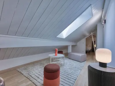 a dining room with a white table and chairs at Duplex 83m², 3 chambres, 6 pers, centre Saint-Gervais, à 5 min de la télécabine, Wifi inclus - FR-1-663-31 in Saint-Gervais-les-Bains