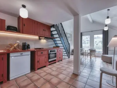 a bedroom with two beds and a mirror at Duplex 83m², 3 chambres, 6 pers, centre Saint-Gervais, à 5 min de la télécabine, Wifi inclus - FR-1-663-31 in Saint-Gervais-les-Bains