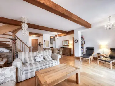a living room with two couches and a table at Appartement duplex avec vue montagne, 8 pers, parking, Wi-Fi - FR-1-663-36 in Saint-Gervais-les-Bains