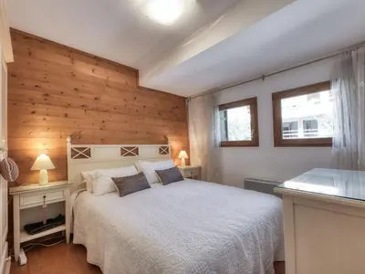 a dining room and living room with a table and chairs at Appartement duplex avec vue montagne, 8 pers, parking, Wi-Fi - FR-1-663-36 in Saint-Gervais-les-Bains