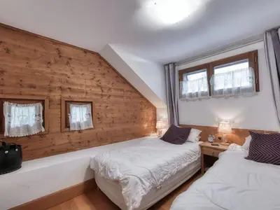 a bedroom with a large bed and a large window at Appartement duplex avec vue montagne, 8 pers, parking, Wi-Fi - FR-1-663-36 in Saint-Gervais-les-Bains