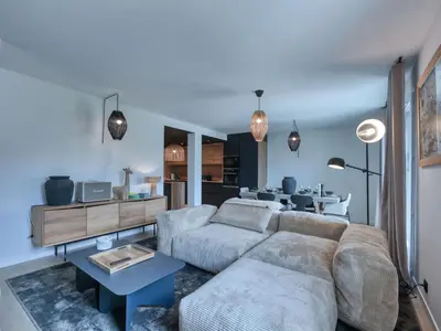 a living room with a couch and a table at Charmant appartement au centre, 4 pers, avec Wifi et parking - FR-1-663-44 in Saint-Gervais-les-Bains