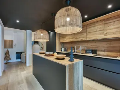 a living room with a couch and a brick wall at Charmant appartement au centre, 4 pers, avec Wifi et parking - FR-1-663-44 in Saint-Gervais-les-Bains
