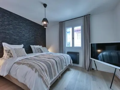 a living room with a table and chairs and a couch at Charmant appartement au centre, 4 pers, avec Wifi et parking - FR-1-663-44 in Saint-Gervais-les-Bains