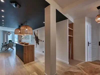a bedroom with a bed and a brick wall at Charmant appartement au centre, 4 pers, avec Wifi et parking - FR-1-663-44 in Saint-Gervais-les-Bains