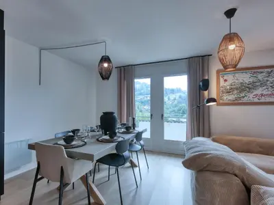 a kitchen with two pendant lights and a counter at Charmant appartement au centre, 4 pers, avec Wifi et parking - FR-1-663-44 in Saint-Gervais-les-Bains