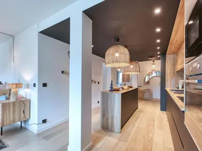 a room with a dining room and a kitchen with a ceiling at Charmant appartement au centre, 4 pers, avec Wifi et parking - FR-1-663-44 in Saint-Gervais-les-Bains