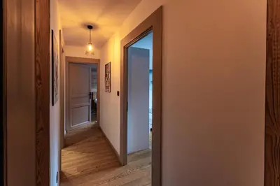 a hallway with a door leading into a room at Alpin chic au cœur de Chamonix in Chamonix-Mont-Blanc