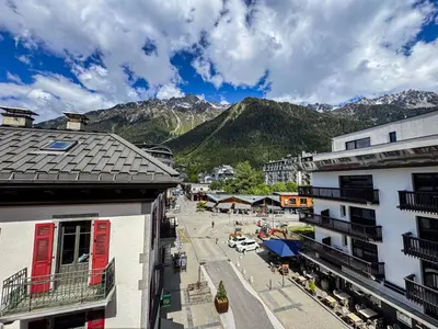 a view of a town with mountains in the background at Alpin chic au cœur de Chamonix in Chamonix-Mont-Blanc