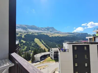 a view of a mountain from a balcony of a building at Appartement spacieux Flain - Ski aux pieds et parking - FR-1-425-235 in Arâches-la-Frasse