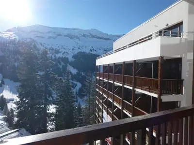 a building with a view of a mountain at Appartement spacieux Flain - Ski aux pieds et parking - FR-1-425-235 in Arâches-la-Frasse