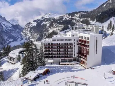 a hotel on top of a snow covered mountain at Appartement spacieux Flain - Ski aux pieds et parking - FR-1-425-235 in Arâches-la-Frasse